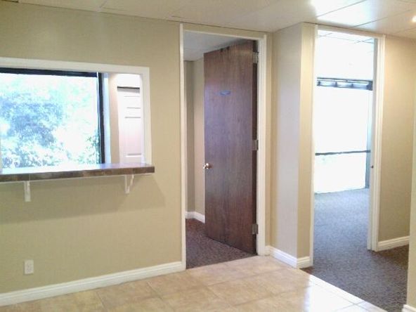 Ground floor office with beautiful tile entry and reception. Several uses.